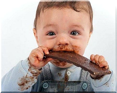 very sticky and happy baby eats chocolate