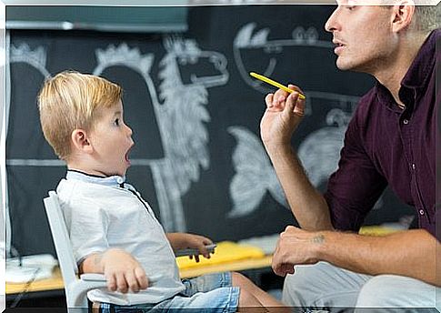 Children with their mouths open in language therapy.