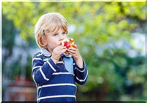 A child eating an apple.