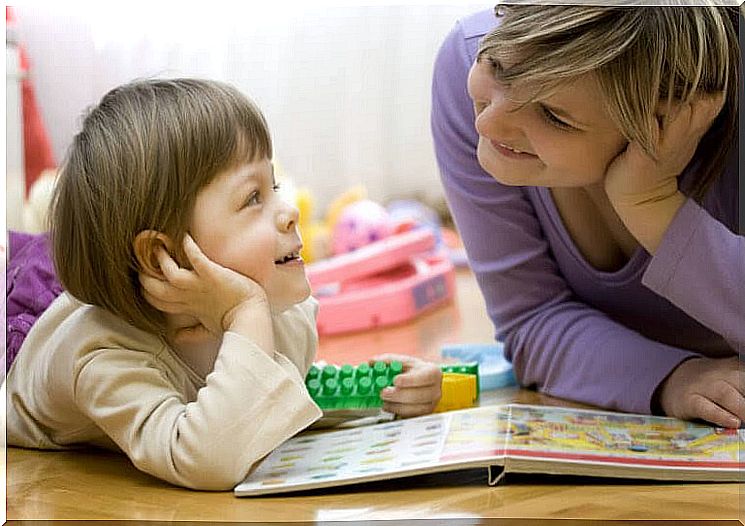 mother and child looking in book