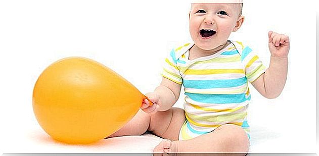 Baby with balloon.