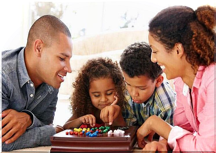 Prevent video game addiction: Family playing board games