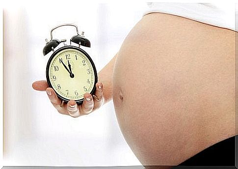 Pregnant woman with watch