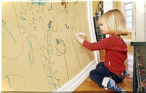 girl draws on wall