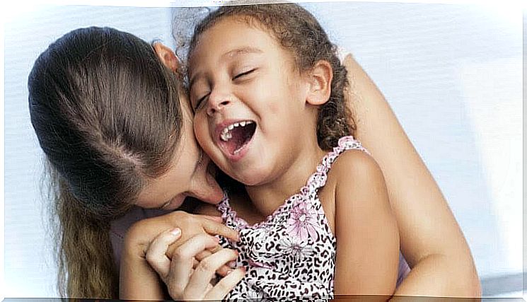 Emotional communication: mother and daughter playing