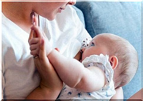 A mother is breastfeeding her baby.