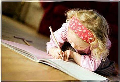 Girl writing in book.