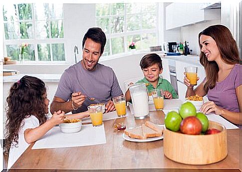 A family eats breakfast together.