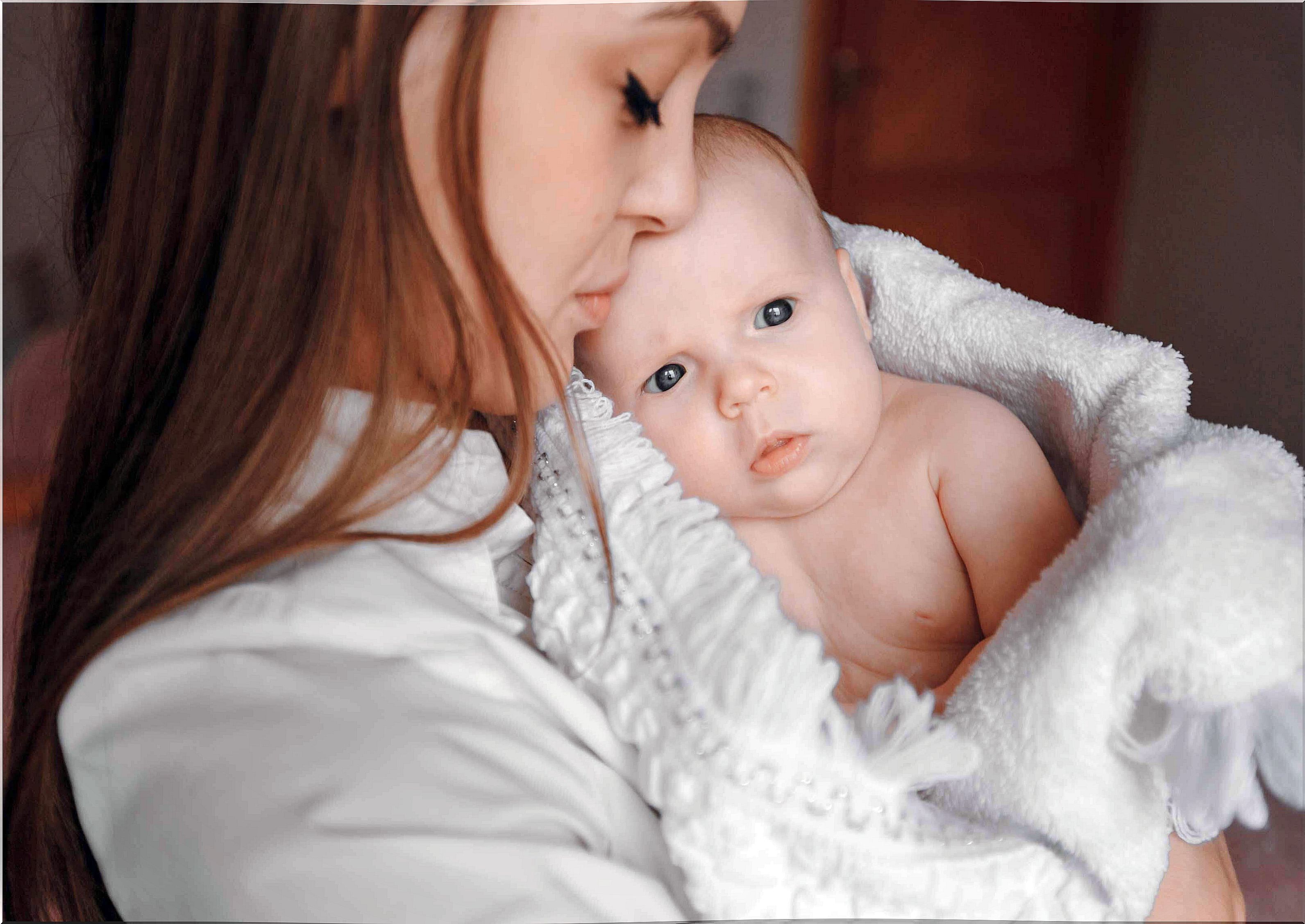 mom holding babies