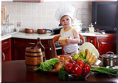 children in the kitchen wear a chef's hat