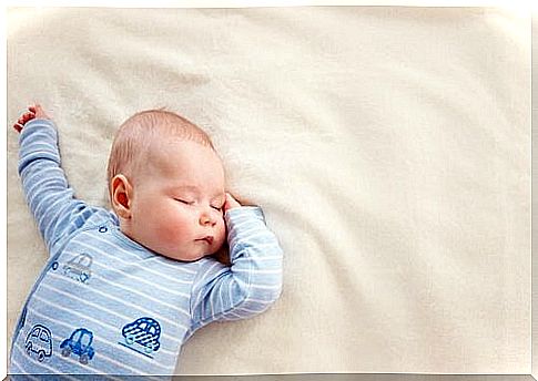 Baby sleeping in bed.