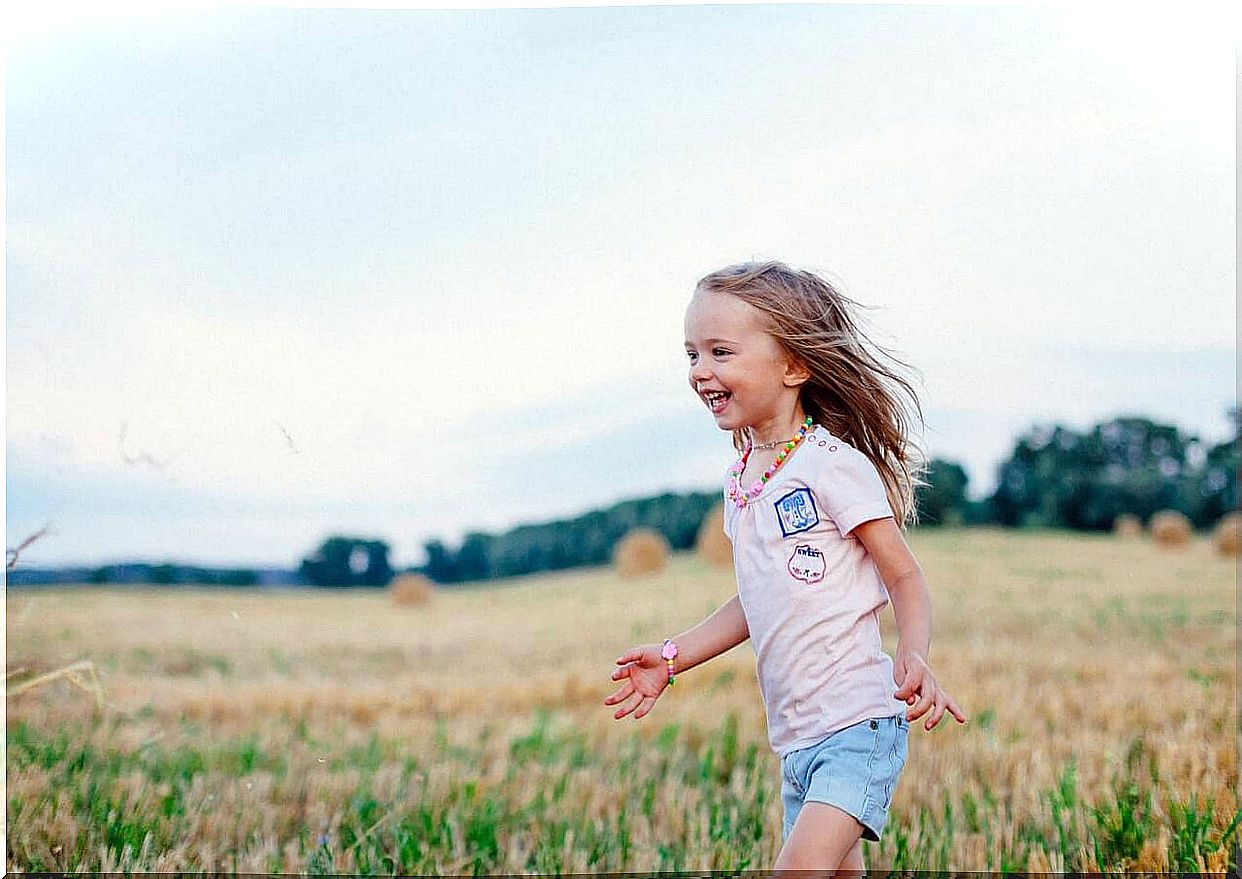 girl running on meadow