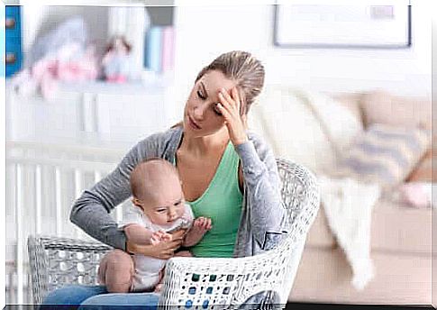 the mother is depressed: tired mother with baby