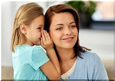 the answers you give: daughter whispers in mother's ear