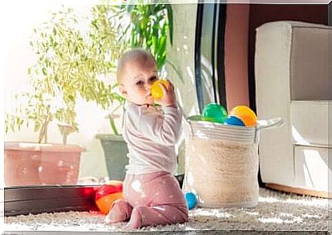 Baby explores the treasure basket