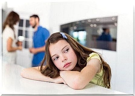 teach children to wait: bored girl waits for parents to finish speaking