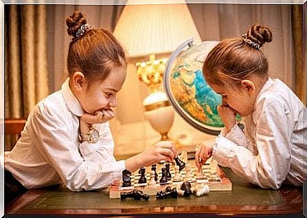 teach children to wait: girls play chess