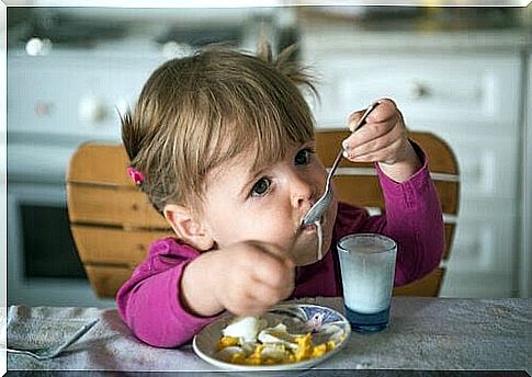 Little girl eating breakfast