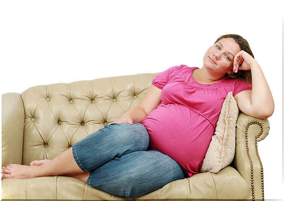 trauma and pregnancy: tired pregnant woman on sofa