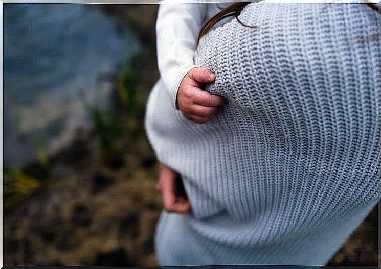 woman carrying baby