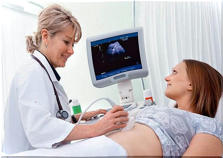 doctor checks a fetus' heartbeat