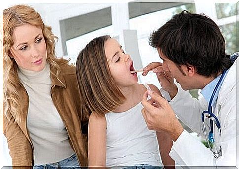 doctors check the tonsils of children