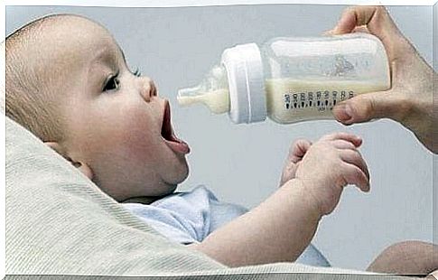 Baby with baby bottle