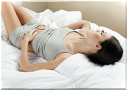 close to crying when you are menstruating: woman with stomach pain