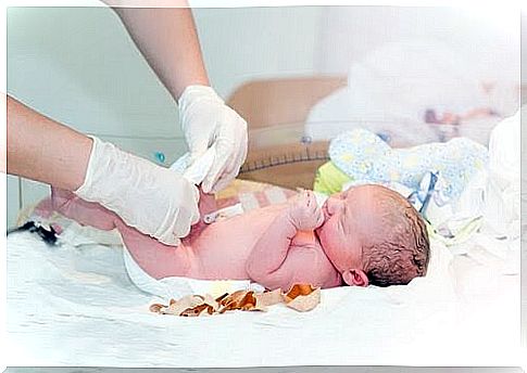 newborn baby with umbilical cord