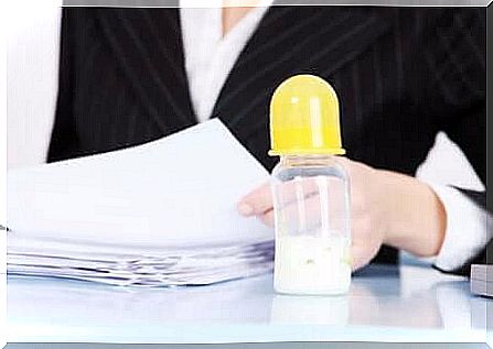 Mom and boss: A baby bottle on the desk.