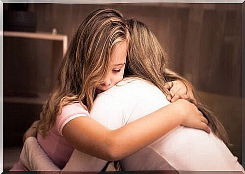 the wounds in the family: mother and daughter hugging